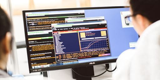 students working with trading and computational finance software