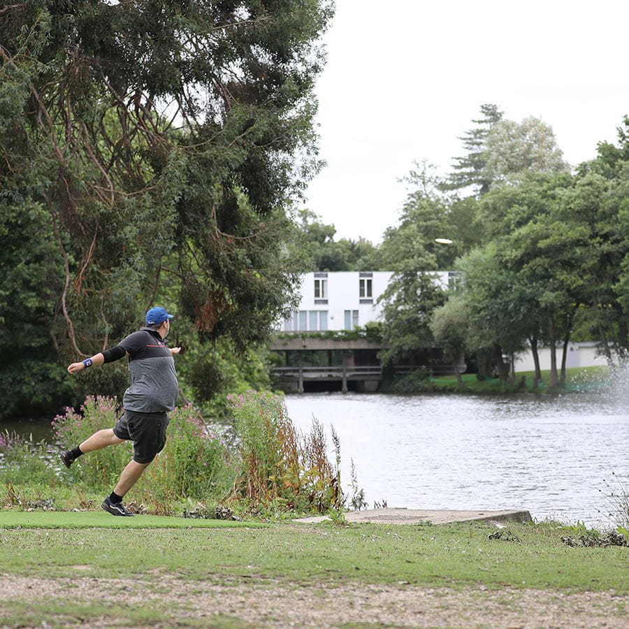 Tournament disc golf players competing