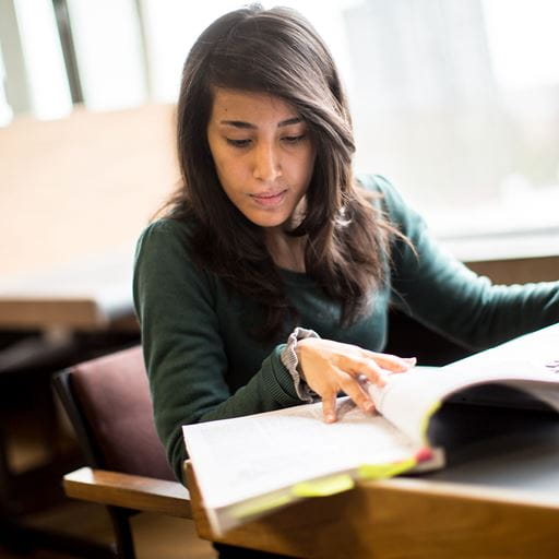 Female student reading a book