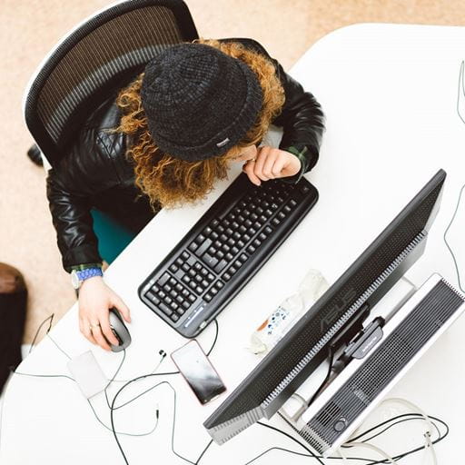 Person sat at computer, photo taken from above