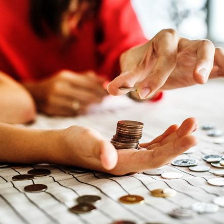 student holding money