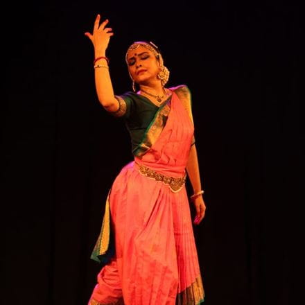Dr Rajashree Warrier performing a dance on stage.