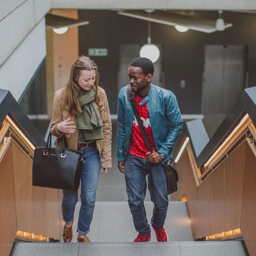 Two students walking together and chatting
