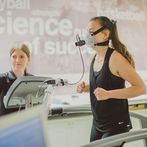 Student being measured with breathing mask whilst running on a specialised treadmill