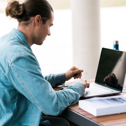 A student completes some work on campus