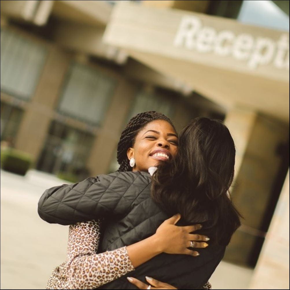Students hugging on campus
