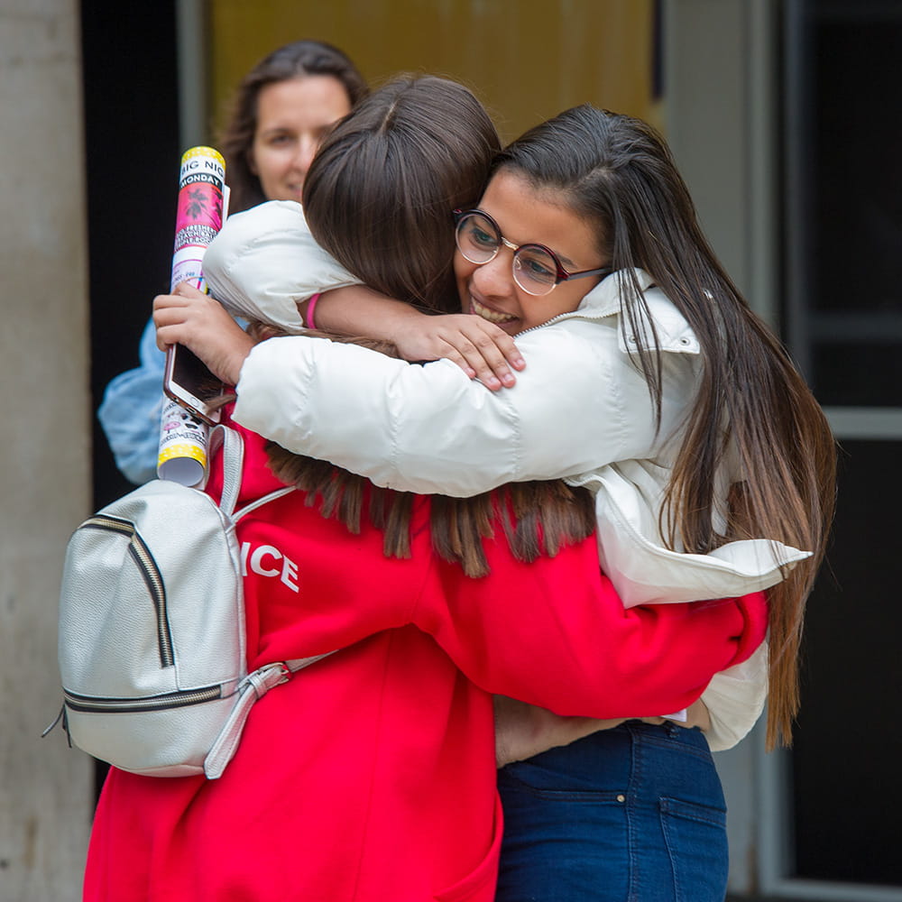 Students hugging during Welcome