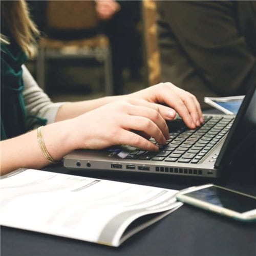 Woman typing on keyboard