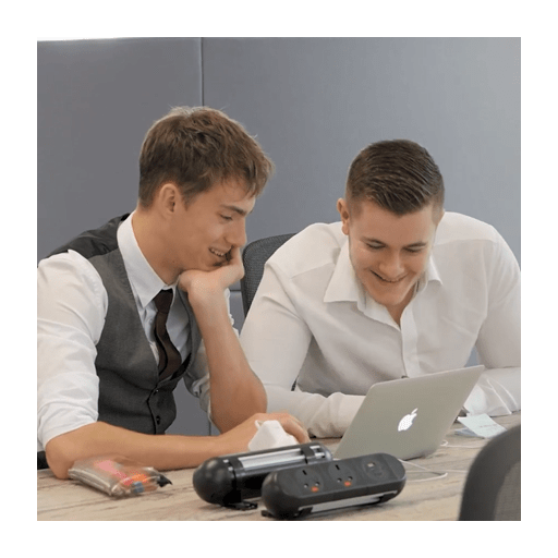 Two male students looking at laptop